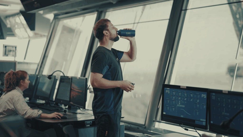 guy drinking from a Hatenboer-Water stainless-steel bottle, avoid plastic bottles, perfect example of how PF@Scontributes to SDG 12